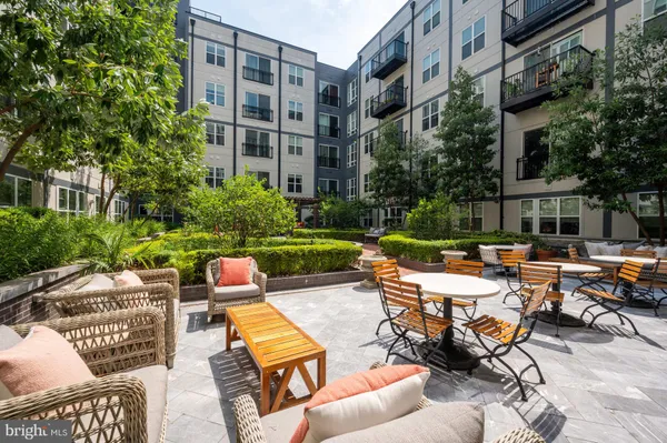 a swimming pool with outdoor seating and yard