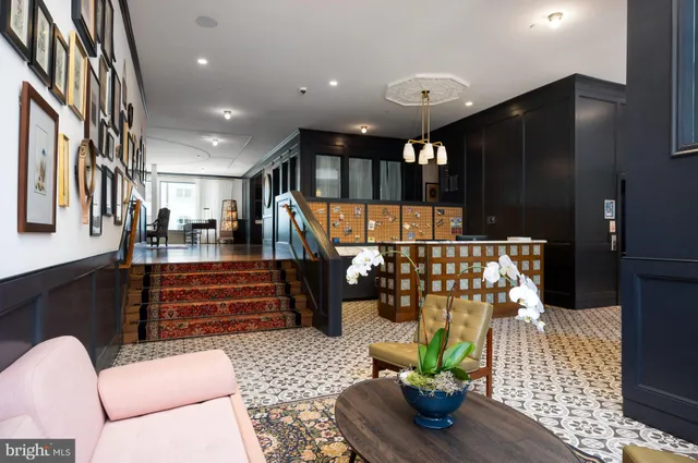 a lobby with furniture and potted plant