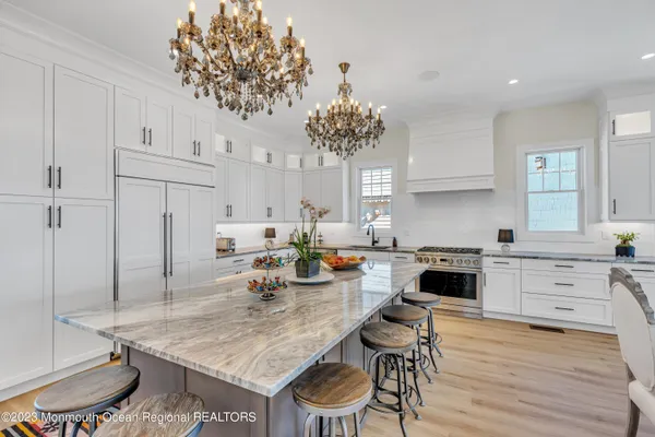 a kitchen with a table and chairs in it