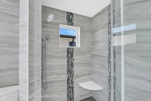 a spacious bathroom with a double vanity sink and mirror
