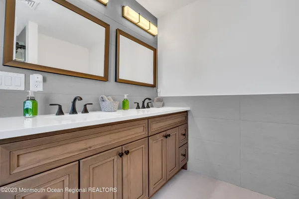 a bedroom with a bed and a dresser in it