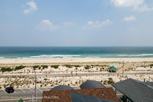 a front view of a house with a parking space