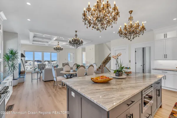 a view of a dining room with furniture and chandelier