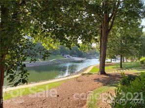 19831 Henderson Road, Unit A Cornelius, NC 28031 - Photo 15 of 15 a view of a lake with a yard