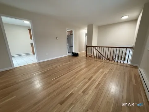 wooden floor in a hall with an entryway