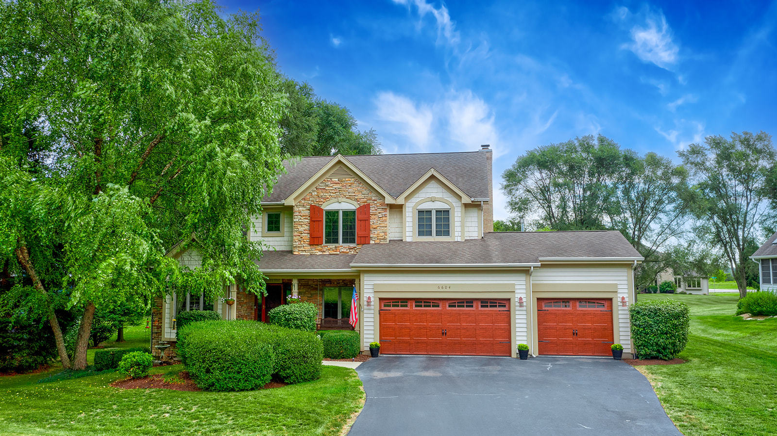 6604 Wildberry Lane Cary, IL 60013 - Photo 2 of 5 a front view of a house with a yard and garage