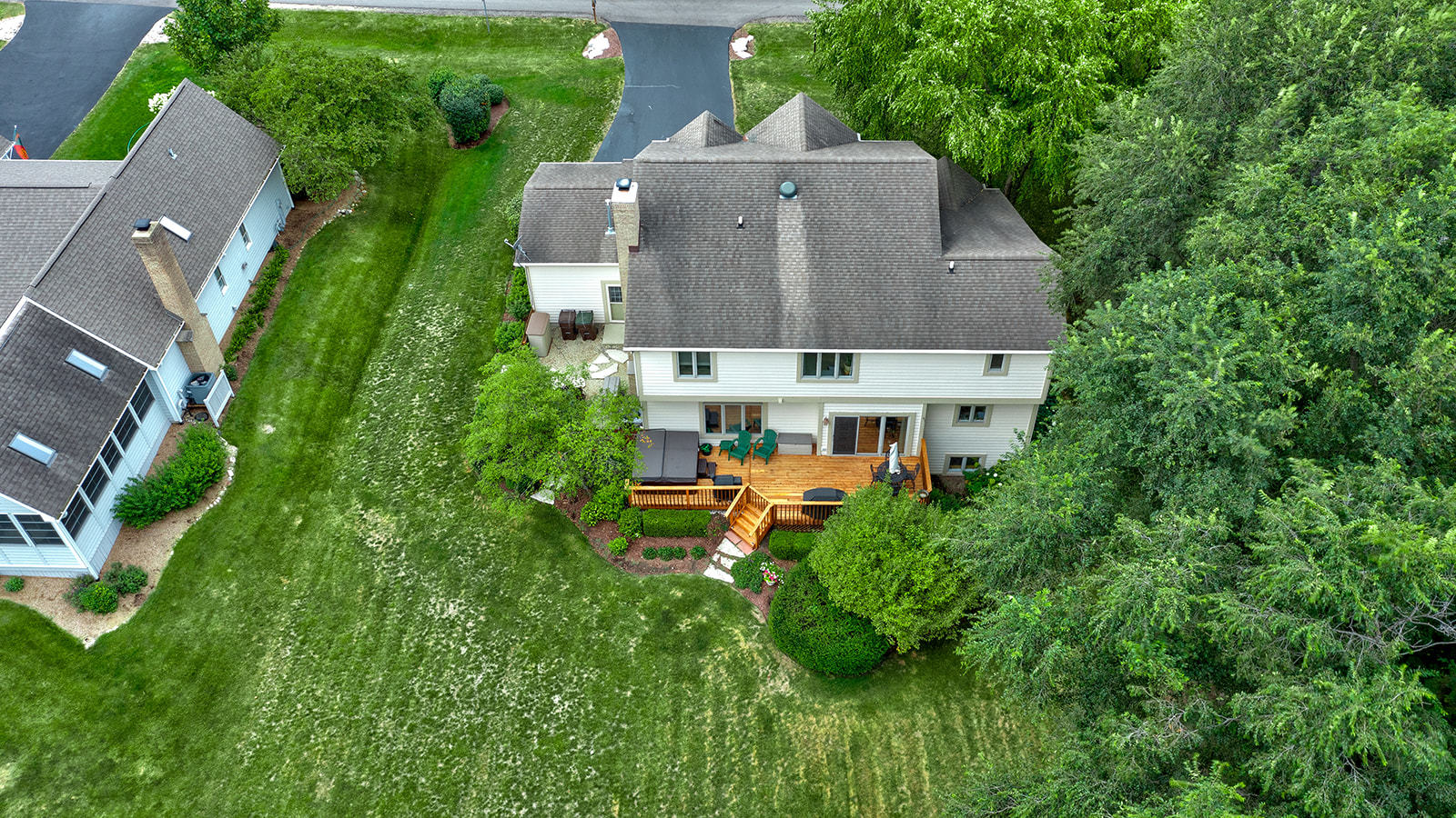 6604 Wildberry Lane Cary, IL 60013 - Photo 5 of 5 an aerial view of a house with table and chairs and a fire pit