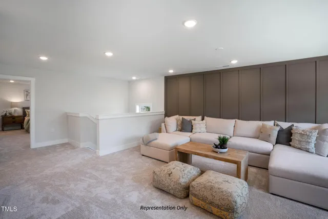 a spacious bedroom with a bed and a couch