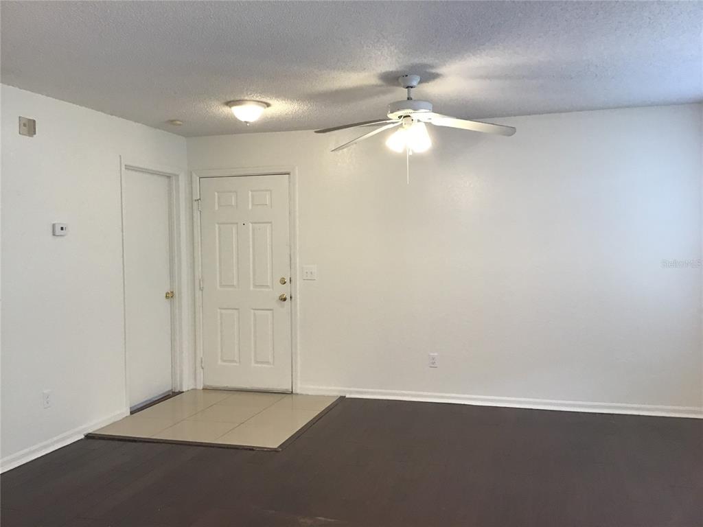 1017 South Hiawassee Road, Unit 3717 Orlando, FL 32835 - Photo 11 of 21 an empty room with a ceiling fan and a window