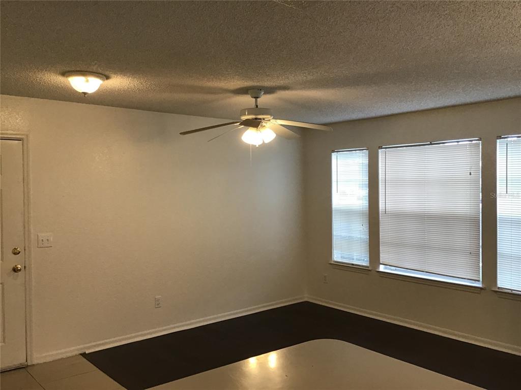 1017 South Hiawassee Road, Unit 3717 Orlando, FL 32835 - Photo 3 of 21 a view of an empty room with a window