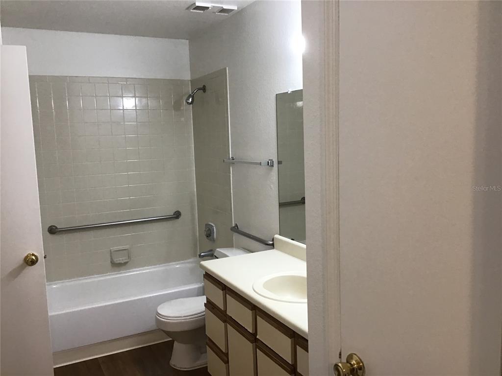 1017 South Hiawassee Road, Unit 3717 Orlando, FL 32835 - Photo 9 of 21 a bathroom with a sink a toilet and a bathtub