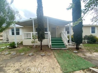 a view of a house with backyard porch and sitting area