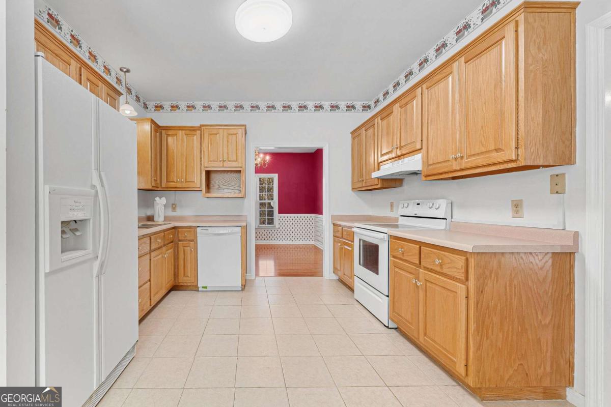 6270 Old Jefferson Road Athens, GA 30607 - Photo 11 of 33 a kitchen with stainless steel appliances granite countertop a stove a sink dishwasher and a refrigerator