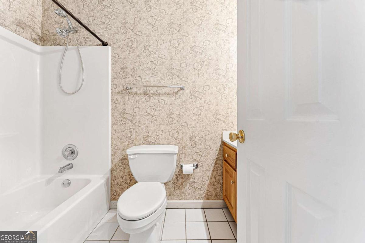 6270 Old Jefferson Road Athens, GA 30607 - Photo 22 of 33 a white toilet sitting next to a bath tub and a shower