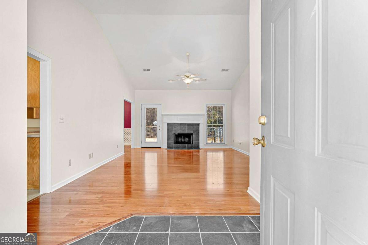 6270 Old Jefferson Road Athens, GA 30607 - Photo 4 of 33 a view of a livingroom with wooden floor and a fireplace