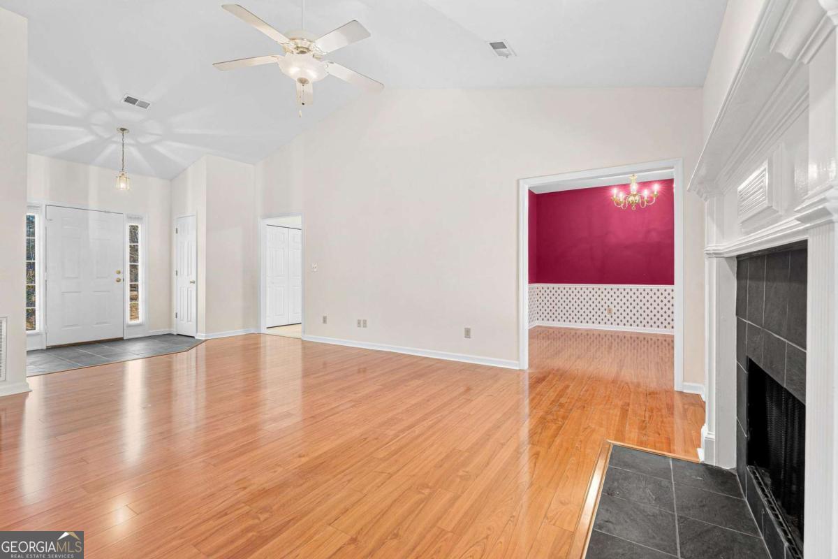 6270 Old Jefferson Road Athens, GA 30607 - Photo 7 of 33 a view of empty room with wooden floor and fireplace