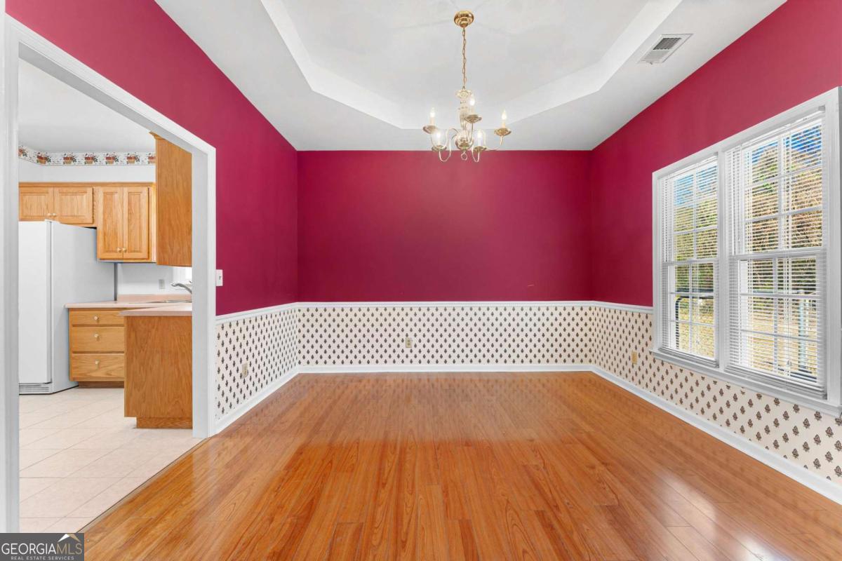 6270 Old Jefferson Road Athens, GA 30607 - Photo 8 of 33 a view of a room with wooden floor and staircase