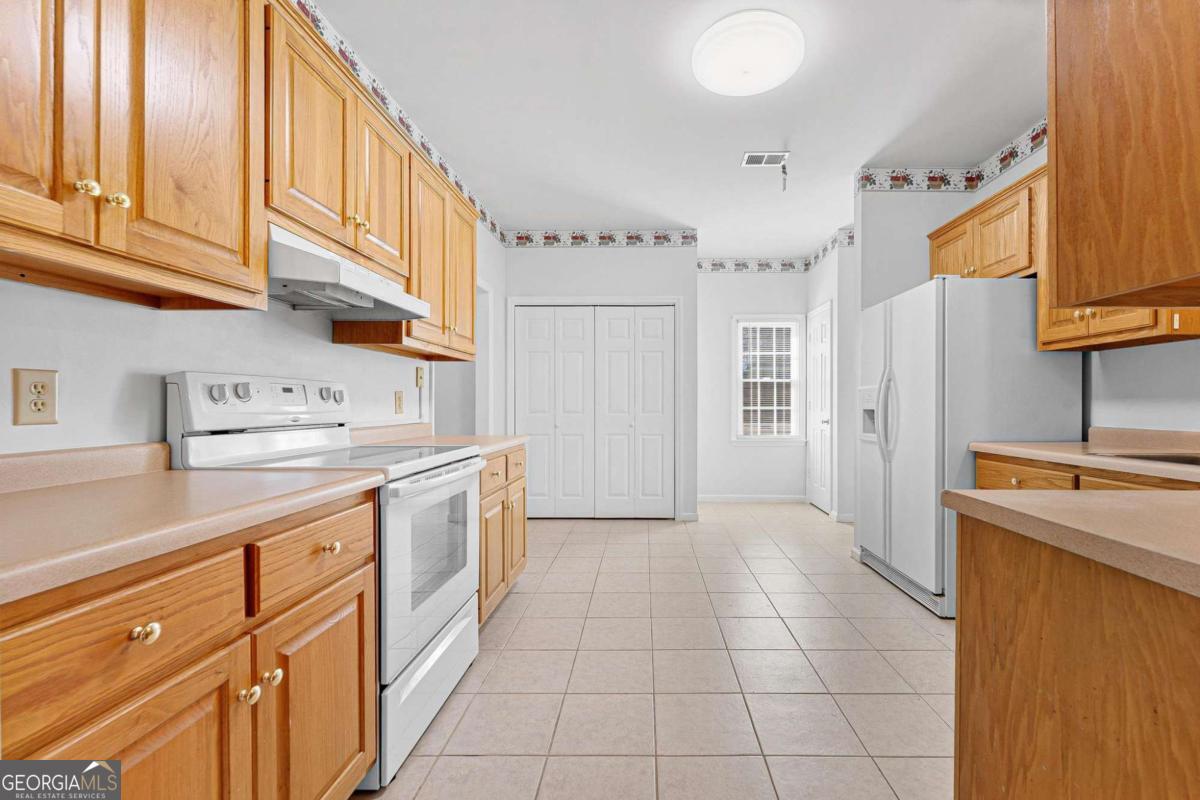 6270 Old Jefferson Road Athens, GA 30607 - Photo 10 of 33 a kitchen with a cabinets and refrigerator