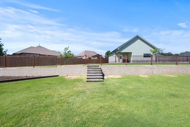 a view of an outdoor space and basketball court