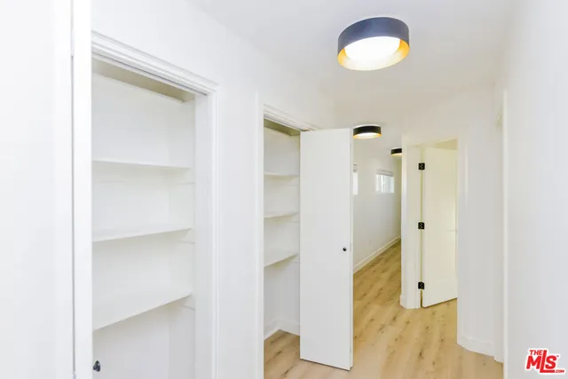 a small room with a wooden door