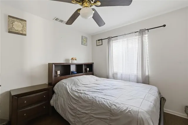 a bedroom with a bed and cabinets