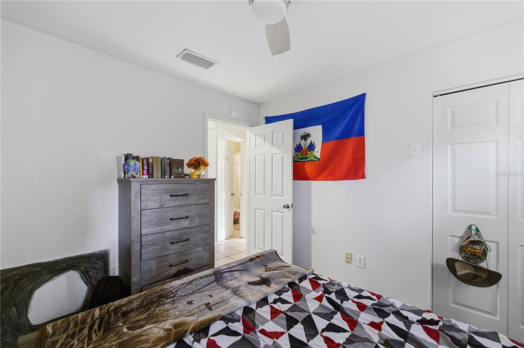 1939 Southwest 73rd Terrace Gainesville, FL 32607 - Photo 20 of 26 a bedroom with a bed and cabinets
