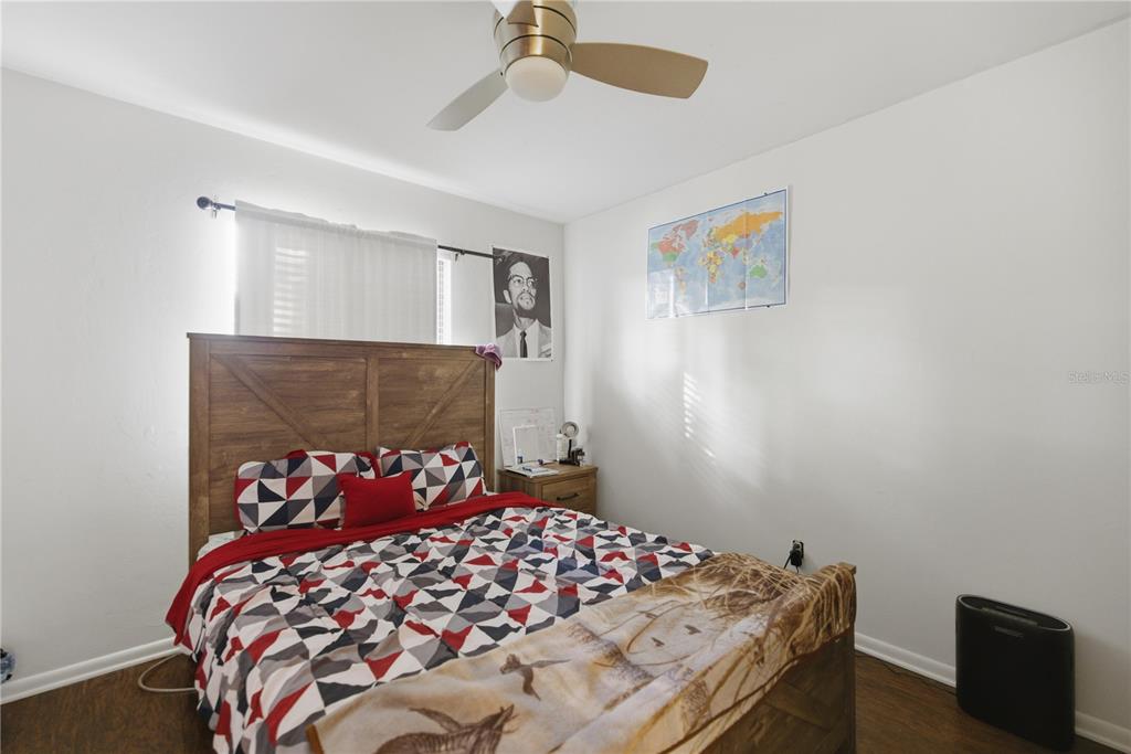 1939 Southwest 73rd Terrace Gainesville, FL 32607 - Photo 21 of 26 a bedroom with a bed and a window