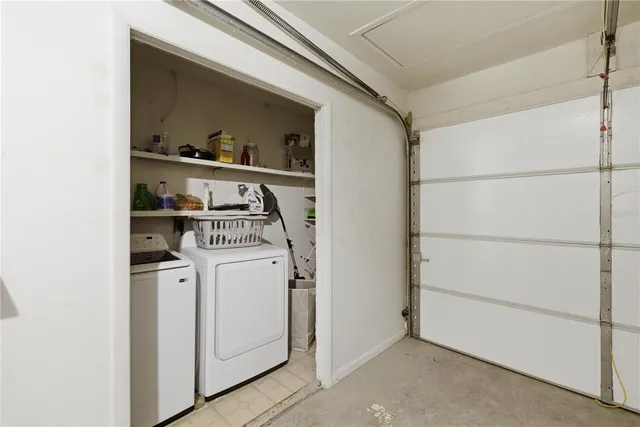 an aerial view of residential house with outdoor space and trees all around