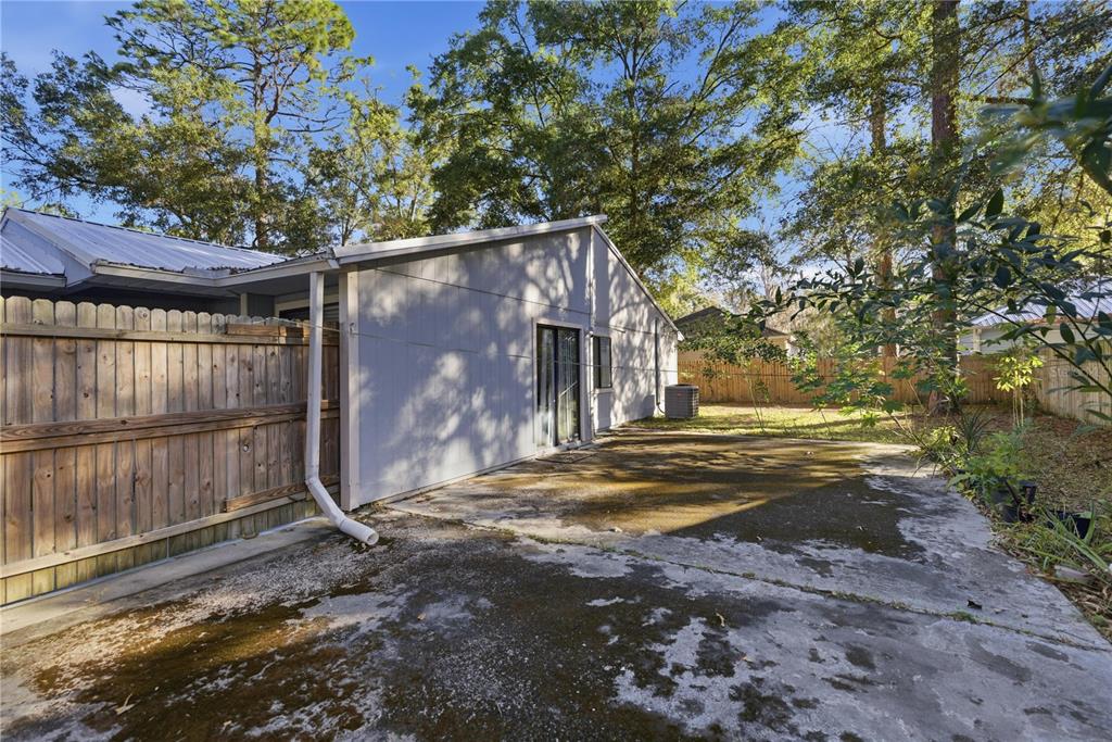 1939 Southwest 73rd Terrace Gainesville, FL 32607 - Photo 3 of 26 a view of a house with backyard and sitting area