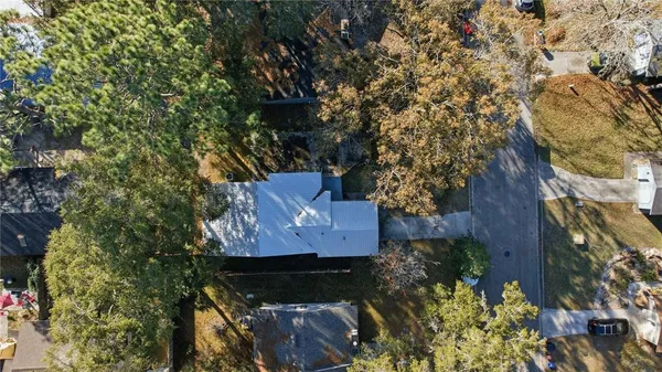 a view of house with a yard