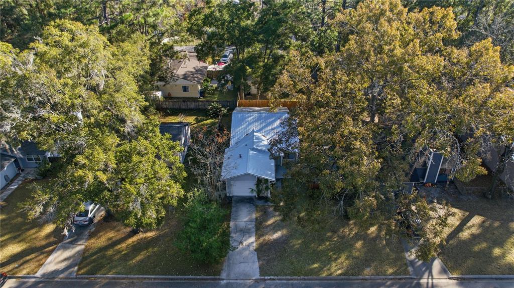 1939 Southwest 73rd Terrace Gainesville, FL 32607 - Photo 5 of 26 an aerial view of a house with a yard basket ball court and outdoor seating