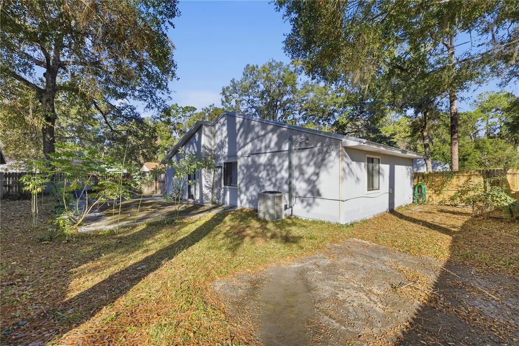 1939 Southwest 73rd Terrace Gainesville, FL 32607 - Photo 6 of 26 a view of a house with pool and sitting area