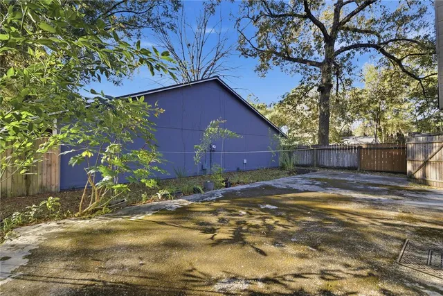 a backyard of a house with lots of green space