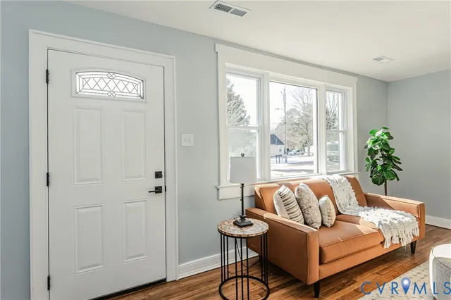 a view of a dining room with furniture and window