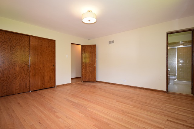 237 Blackhawk Road Riverside, IL 60546 - Photo 14 of 23 an empty room with wooden floor and windows