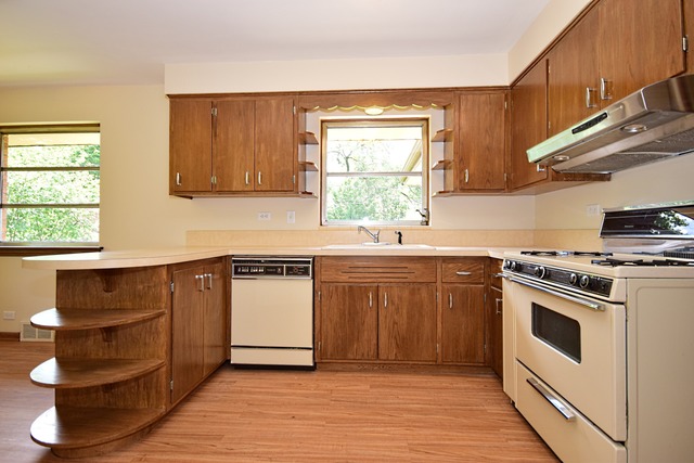 237 Blackhawk Road Riverside, IL 60546 - Photo 8 of 23 a kitchen with a sink stove and cabinets