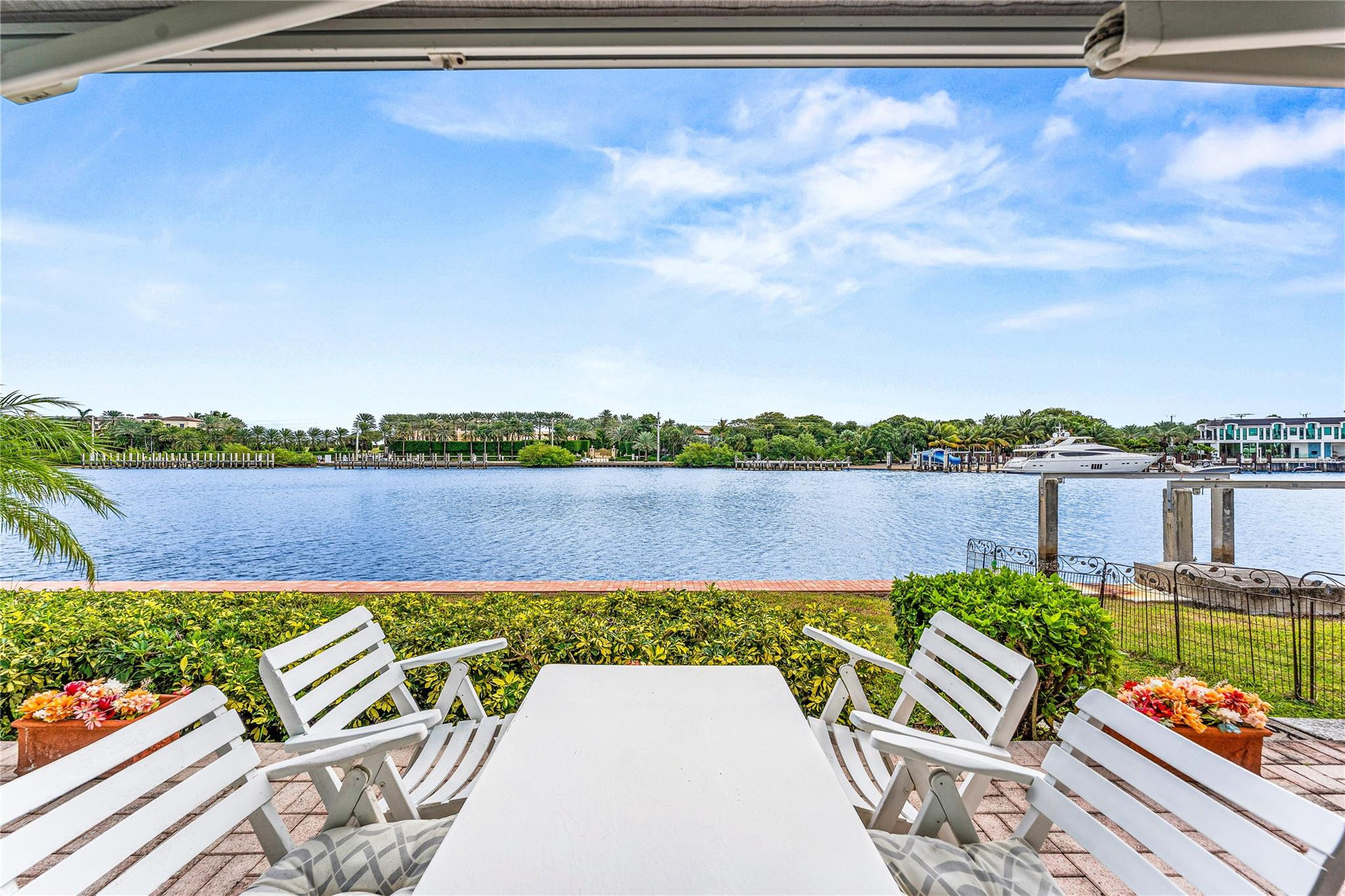 2758 Northeast 30th Avenue, Unit 1A Lighthouse Point, FL 33064 - Photo 1 of 48 a view of a lake with couches in front of house