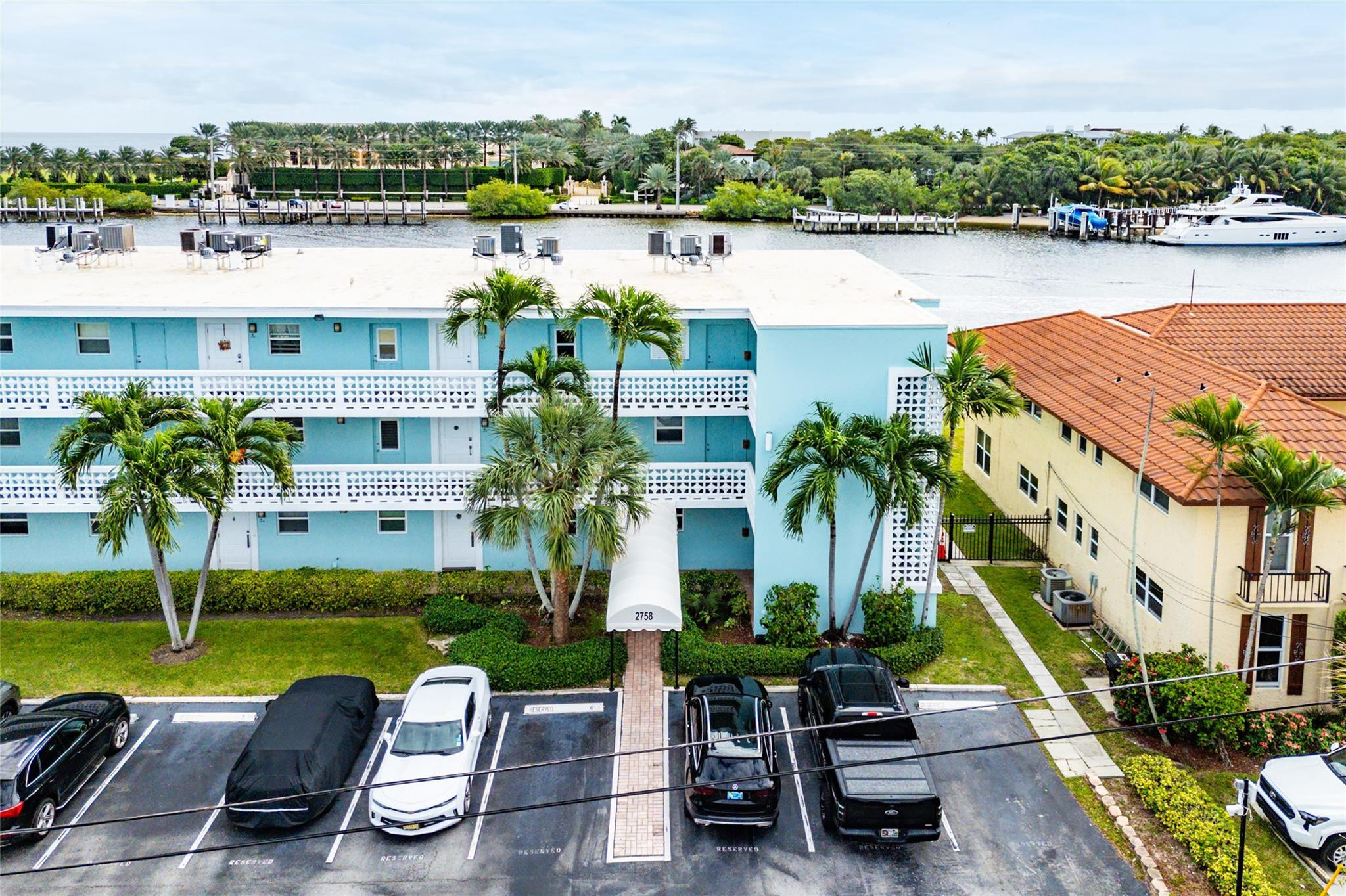 2758 Northeast 30th Avenue, Unit 1A Lighthouse Point, FL 33064 - Photo 13 of 48 an aerial view of a house with outdoor space and lake view