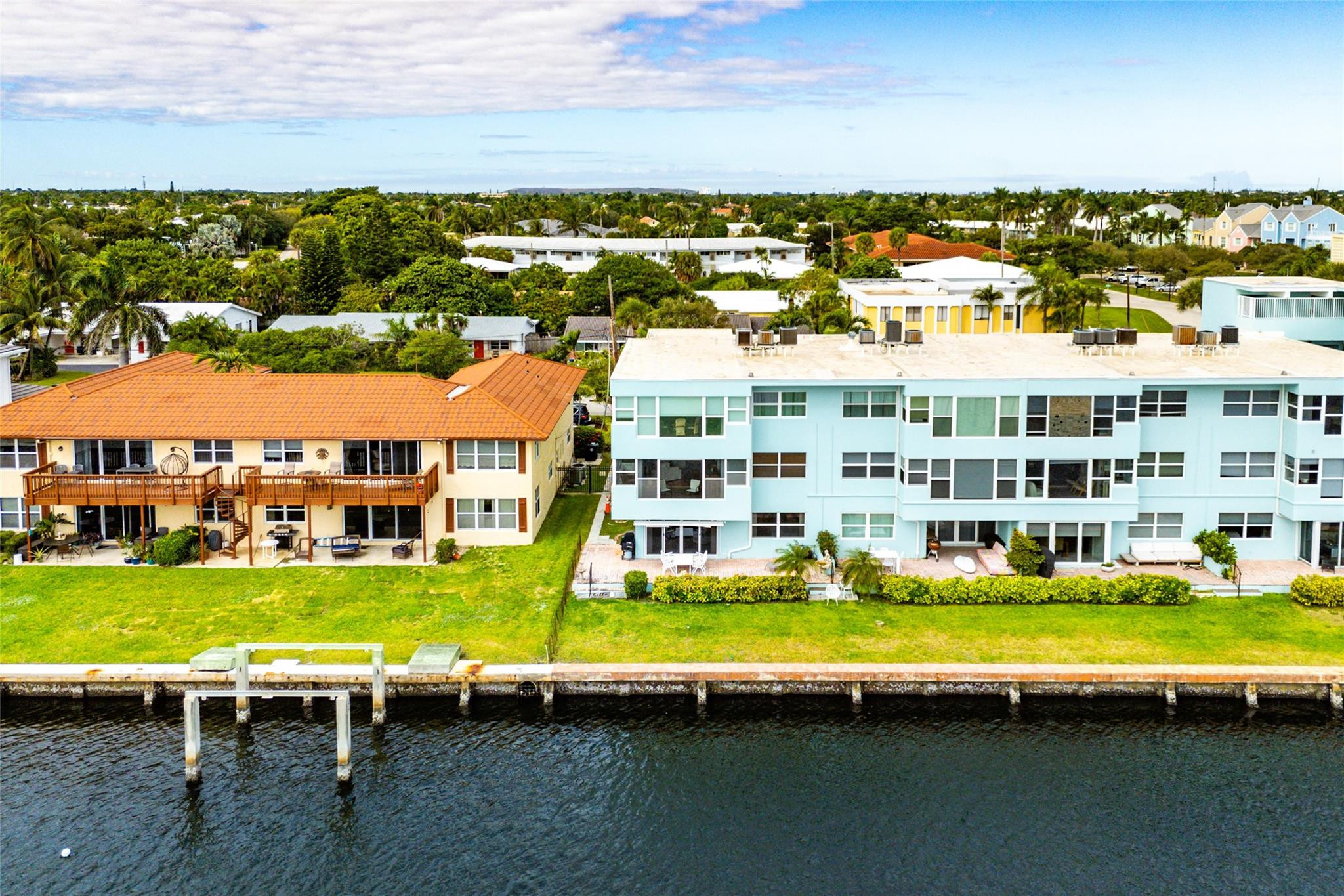 2758 Northeast 30th Avenue, Unit 1A Lighthouse Point, FL 33064 - Photo 14 of 48 a view of a city with lawn chairs