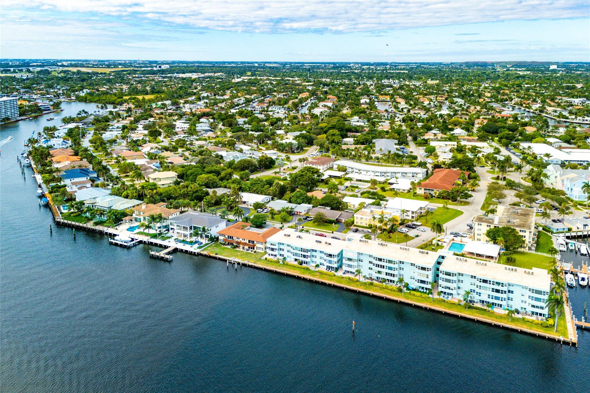 2758 Northeast 30th Avenue, Unit 1A Lighthouse Point, FL 33064 - Photo 19 of 48 an aerial view of residential houses with outdoor space and trees