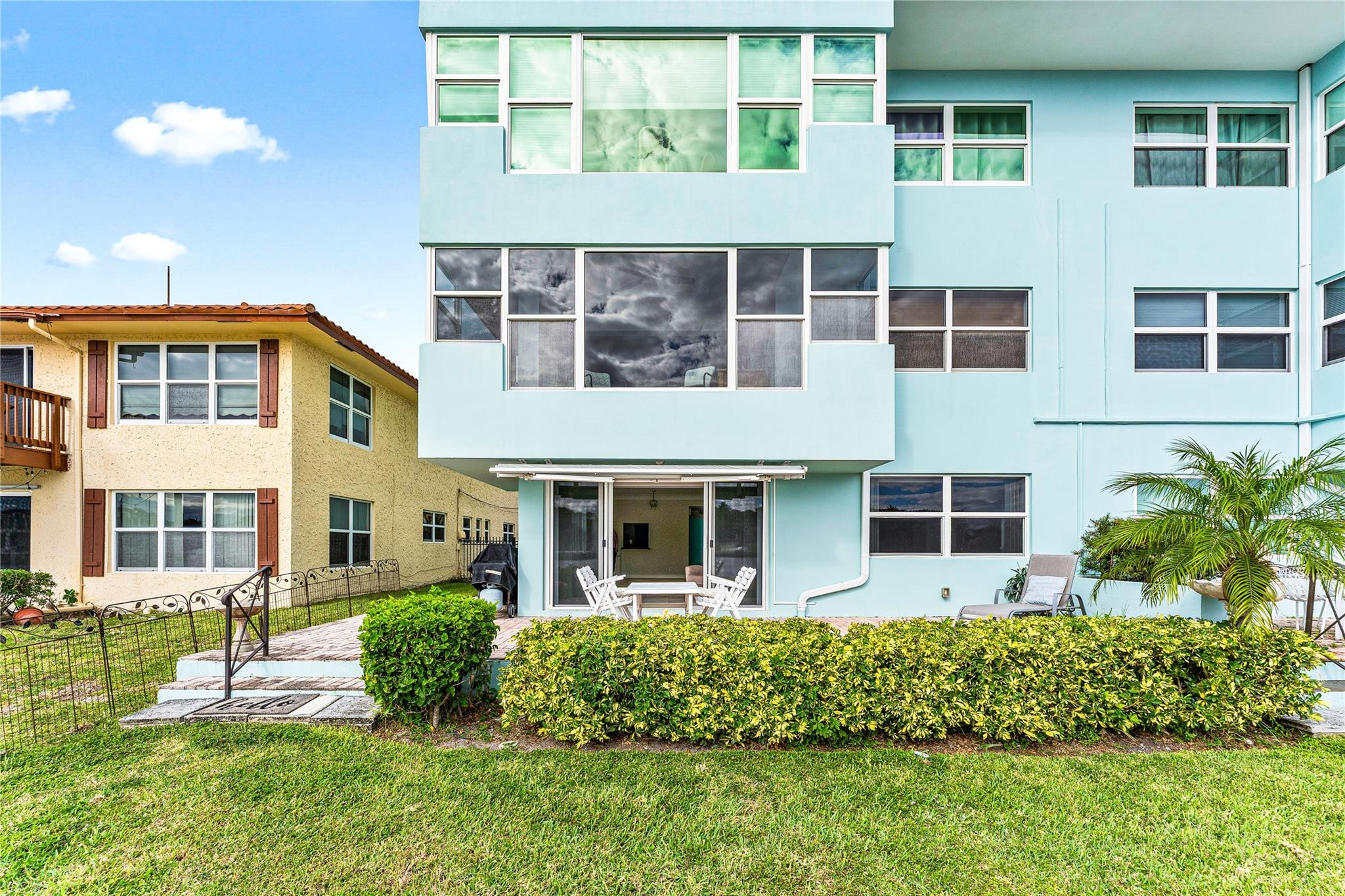 2758 Northeast 30th Avenue, Unit 1A Lighthouse Point, FL 33064 - Photo 20 of 48 front view of a building with a yard