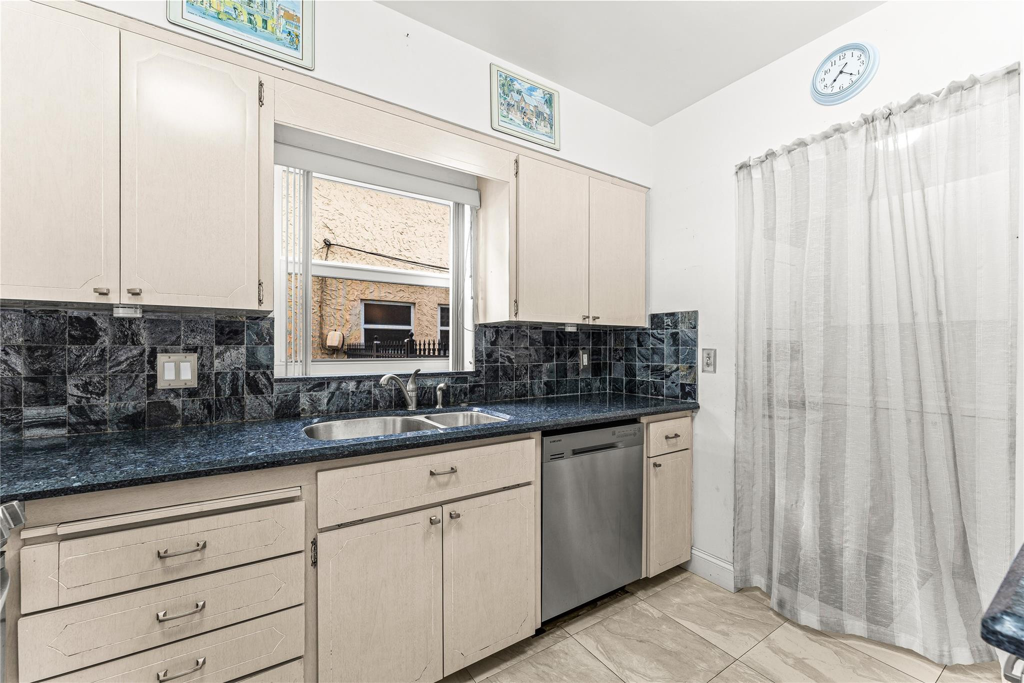2758 Northeast 30th Avenue, Unit 1A Lighthouse Point, FL 33064 - Photo 25 of 48 a bathroom with a granite countertop sink and a mirror