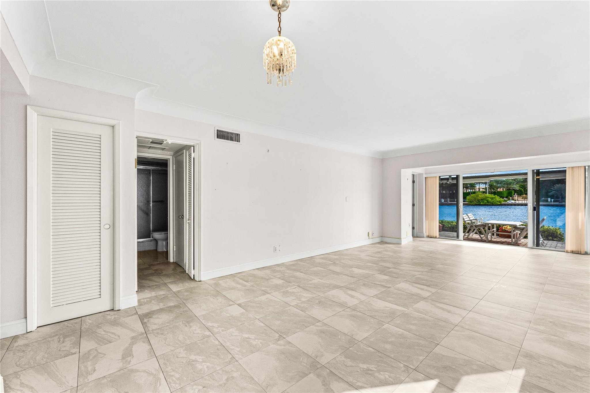 2758 Northeast 30th Avenue, Unit 1A Lighthouse Point, FL 33064 - Photo 27 of 48 a view of an empty room with a window