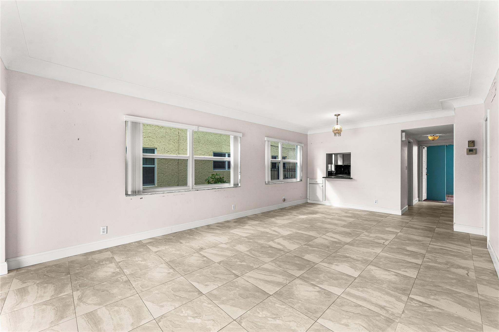 2758 Northeast 30th Avenue, Unit 1A Lighthouse Point, FL 33064 - Photo 29 of 48 a view of an empty room with a window