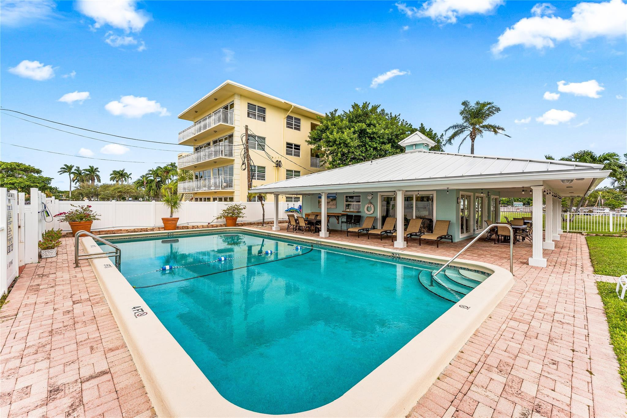 2758 Northeast 30th Avenue, Unit 1A Lighthouse Point, FL 33064 - Photo 44 of 48 a view of a house with swimming pool