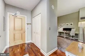 a view of a bedroom with workspace and a window