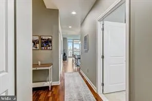 a bathroom with a walk in closet and a mirror