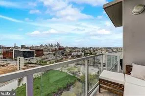 a view of a balcony with two chairs