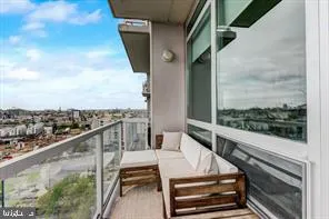 a view of balcony with furniture
