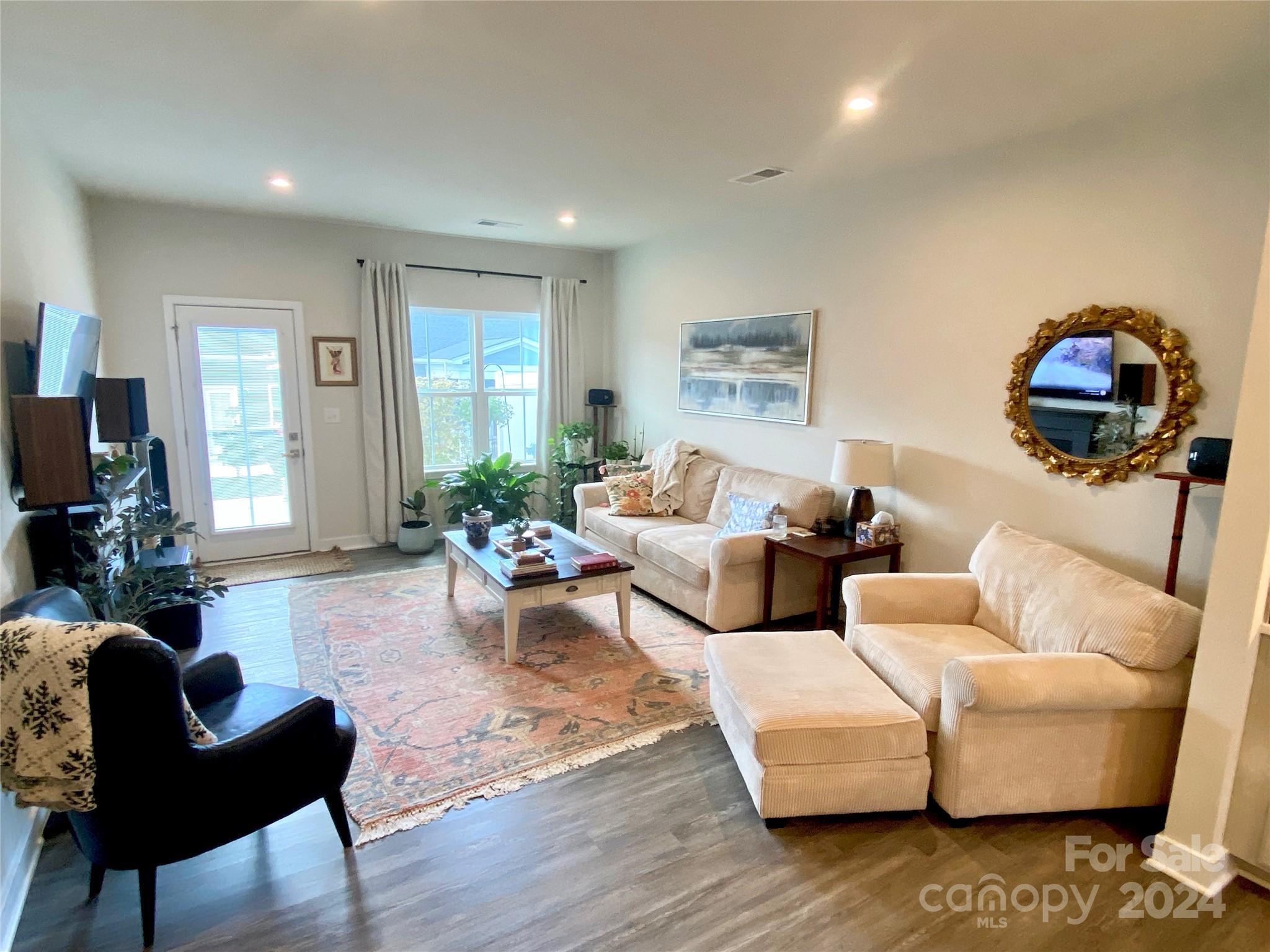 765 Hazel Way Denver, NC 28037 - Photo 11 of 35 a living room with furniture and a wooden floor